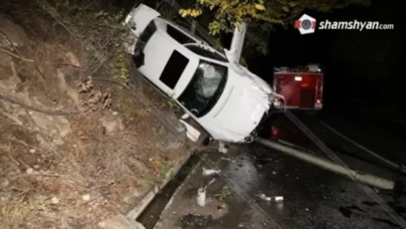 Accident in Yerevan: Mercedes Hits Power Pole and Capsizes onto Trees