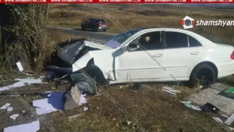 Mercedes Crashes into Billboard and Tree; Driver and Passengers Hospitalized